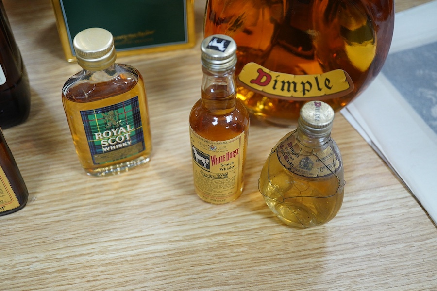 Ten bottles of Whisky including a gallon bottle of Bells. , Condition - good